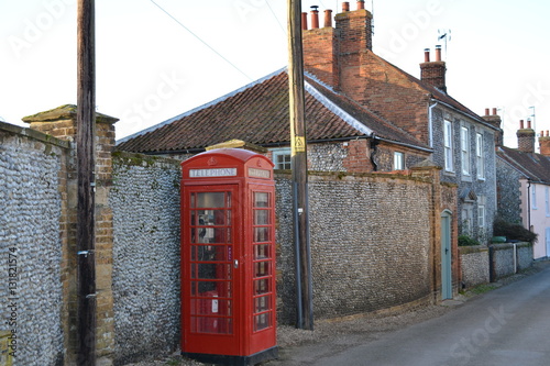 telephone box on in a village on a street  photo