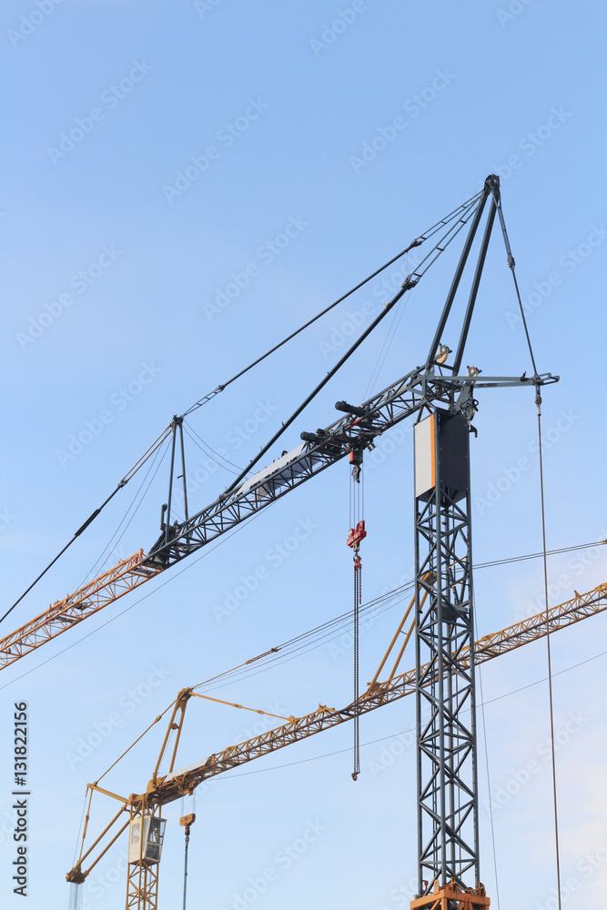 Two cranes on construction side