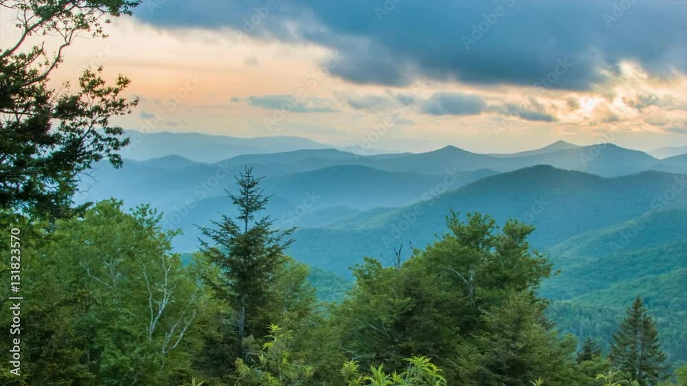 Caney Fork Overlook on the Blue Ridge Parkway at Sunset over the Smoky Mountains near Asheville, North Carolina with layers of the Appalachian Mountains and a Golden Colored Sky
