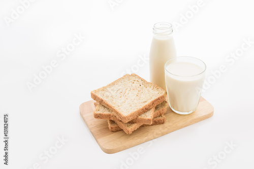 glass of milk and whole wheat bread