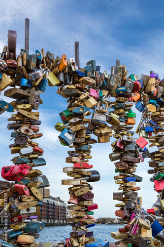 Photography Many colorful padlocks on bridge railing