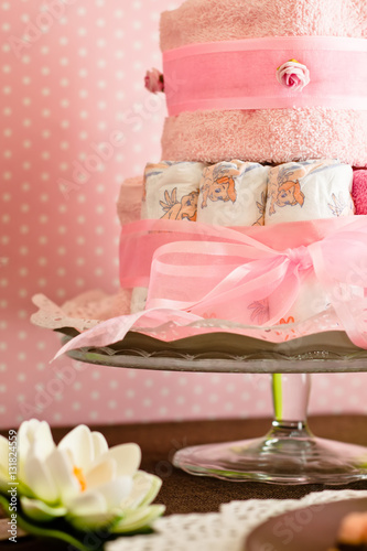 diaper cake with pink background for the new birth of a child
