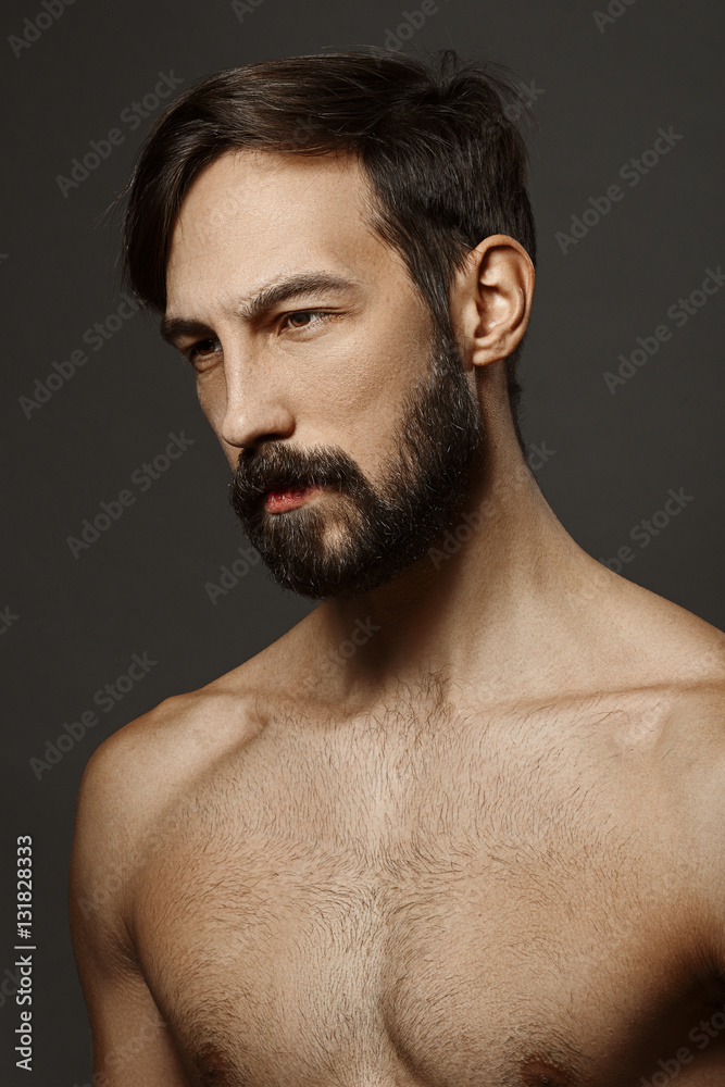 Portrait of topless serious man with beard and mustache looking Portrait of topless serious man with beard and mustache looking