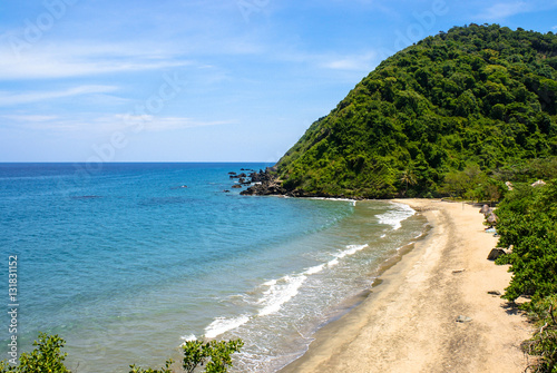 View of a coastline in front of the mountains.