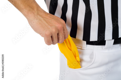 Fotografie Referee: Pulling Penalty Flag From Pocket