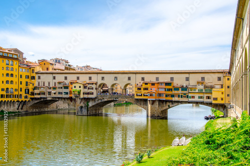Ponte Vecchio, Old Bridge, medieval stone arch bridge over the Arno River and with many small shops along it, Florence, Tuscany, Italy, Europe. UNESCO World Heritage Site