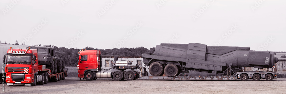 the superheavy linehaulers laden with military technics