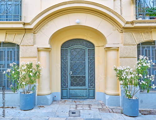 Athens Greece  elegant house arch entrance with flowerpots