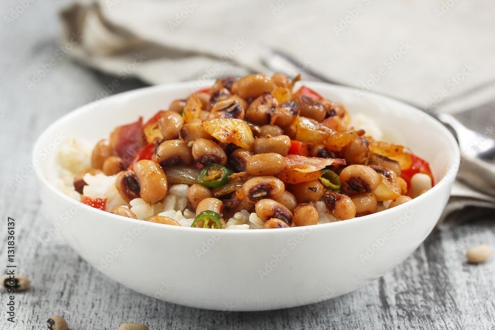 Homemade Hoppin john or carolina Peas served in a white bowl, selective focus Homemade Hoppin john or carolina Peas served in a white bowl, selective focus