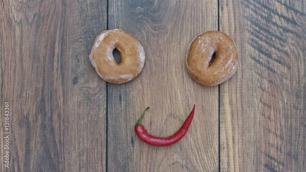4k Donuts Composition on a Wooden Background with Chilli Face 4k Donuts Composition on a Wooden Background with Chilli Face