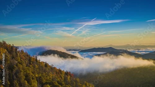 Autumn Sunrise over the Blue Ridge Mountains with Fast Moving Mist and Clouds seen from the Blue Ridge Parkway near Asheville in Western North Carolina