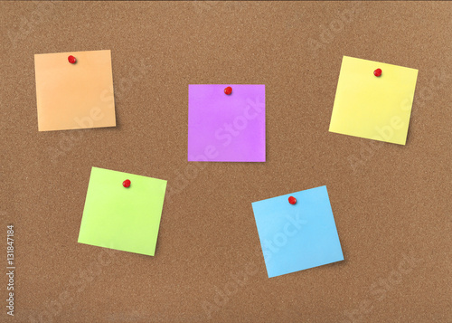 Cork board with colorful blank notes with clipping path