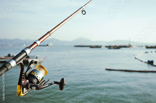 Fishing rod at sea; South Chinese Sea, and Hong Kong S.A.R. in background