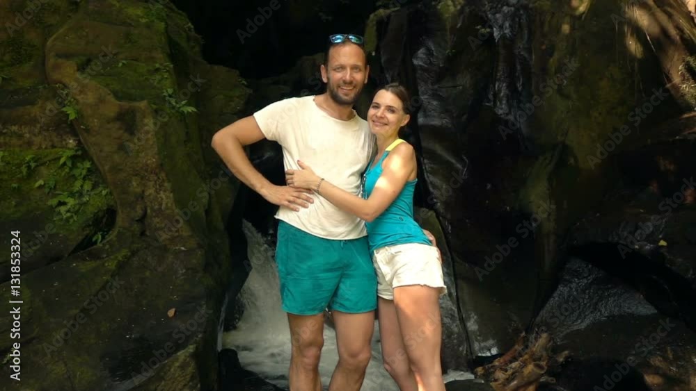 Portrait of young, happy couple standing by waterfall, super slow motion 240fps
Portrait of young, happy couple standing by waterfall, super slow motion 240fps