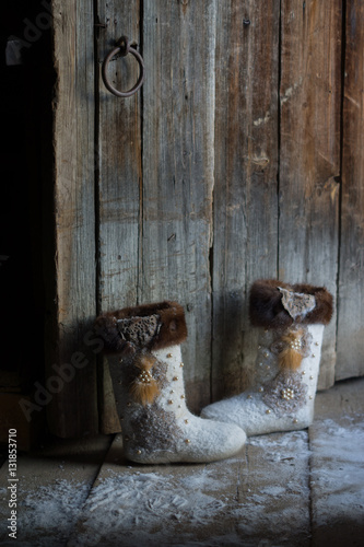 felt boots near the wooden door