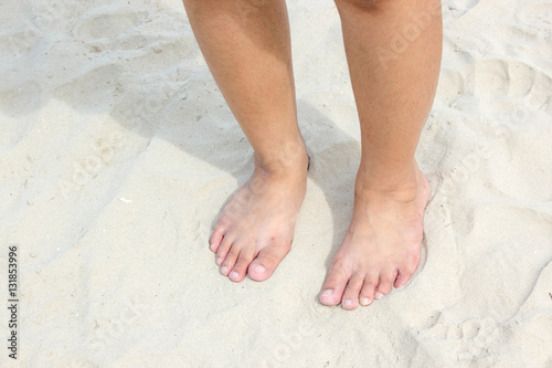 leg of girl on beach