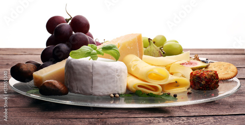 Cheese platter with different cheese and grapes 