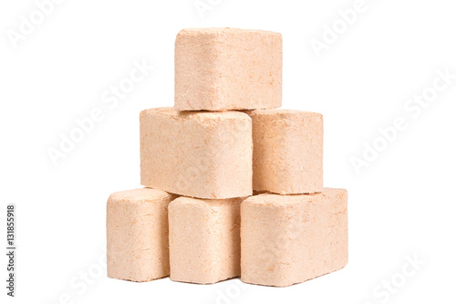 Schilderij op canvas Wood briquettes isolated on white background.
