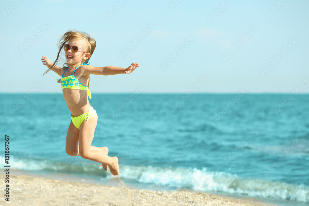 Cute girl having fun on beach