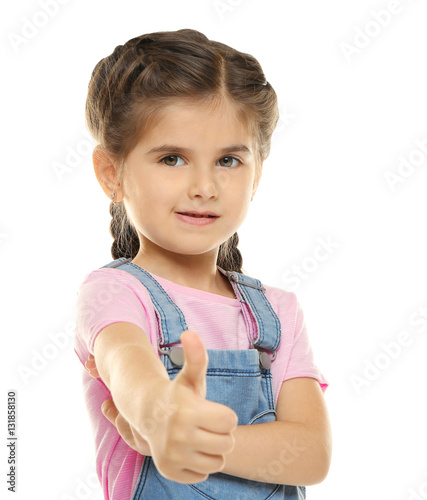 Cute little girl on white b...