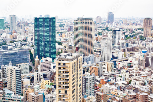 Asia Business concept for real estate and corporate construction - panoramic modern cityscape building bird eye aerial view from tokyo tower under sunrise and morning blue bright sky in Tokyo, Japan © voyata