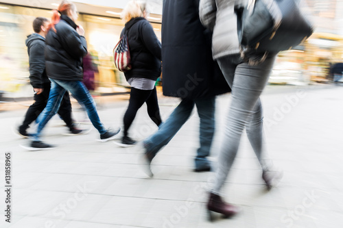 people walking on shopping street with motion blur