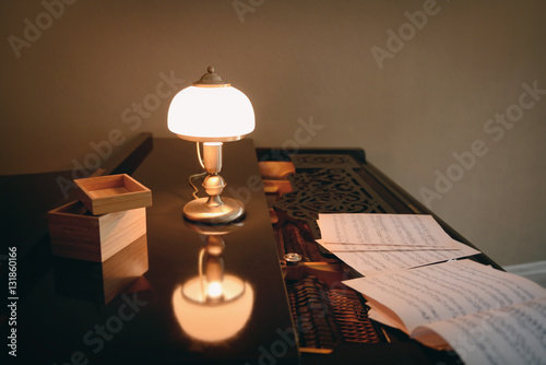 Old lamp on black piano