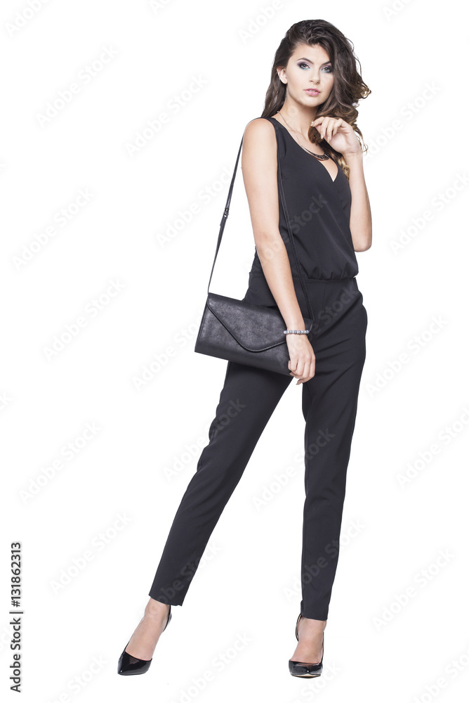 Success woman dressed in business attire with a small bag on her shoulder Success woman dressed in business attire with a small bag on her shoulder