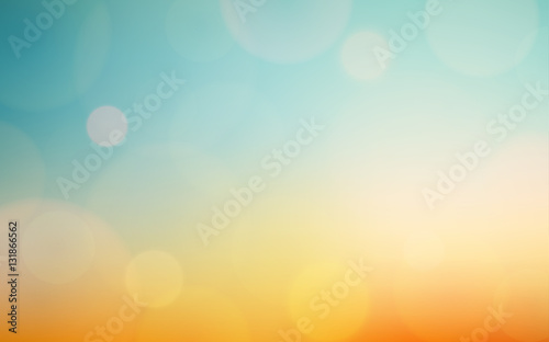 Abstract bokeh and lens flare pattern on blue and yellow color in vintage filter background (vector)