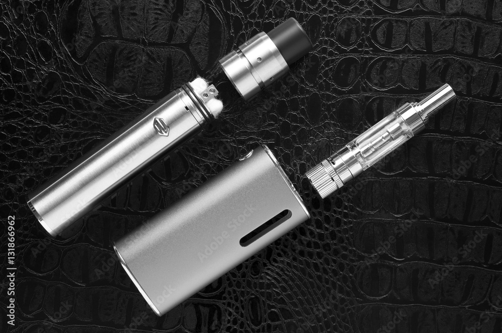 Naklejka premium Electronic cigarette on black background.