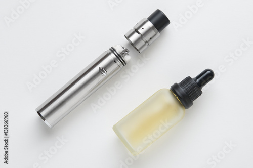 Electronic cigarette and bottle of liquid.