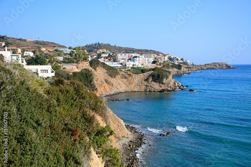 View along the rugged coastline with hotels and apartments to the rear, Bali, Crete.
