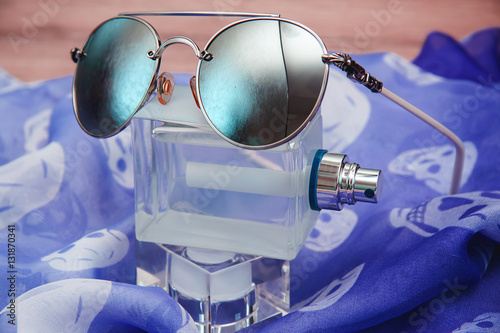 Perfume bottle with sunglasses