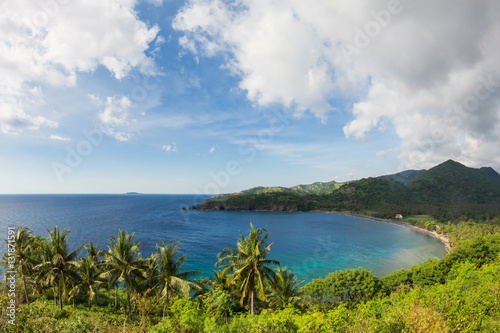 Landscape like a Tropical Paradise with the sea bay surrounded by green mountains  Lombok Island  Indonesia