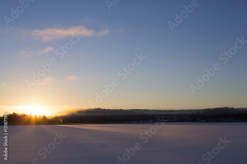 Beautiful sunrise on a winter morning in Finland. Silent moment.