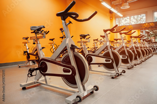 Indoor stationary bikes for spinning cycling classes. a bright o