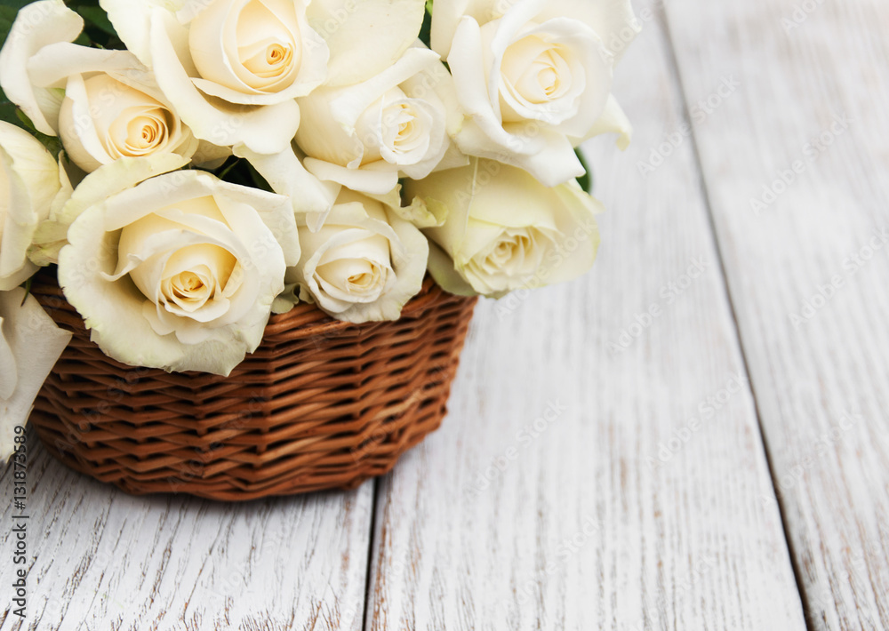 White roses in a basket White roses in a basket