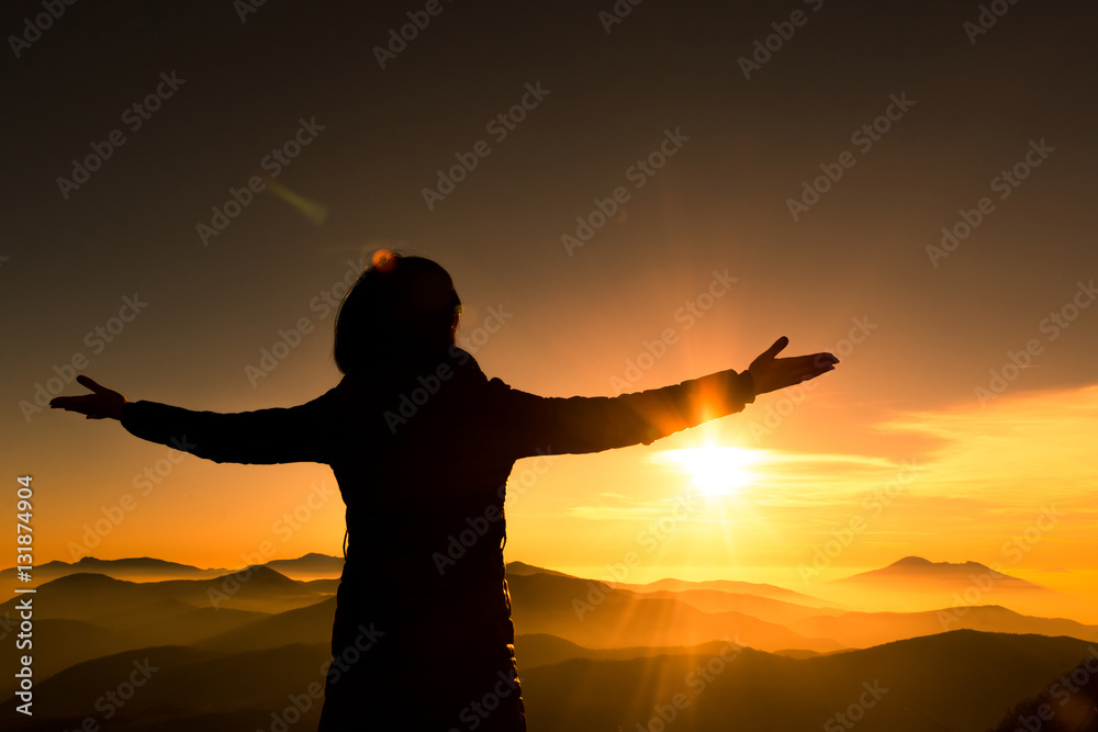 Fototapeta premium Woman on top of mountain. Trip concept.