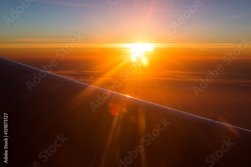 Amazing view from plane. Morning sunrise.