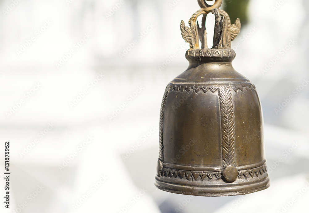 Small Thai style temple bell with white background, outdoor day light Small Thai style temple bell with white background, outdoor day light