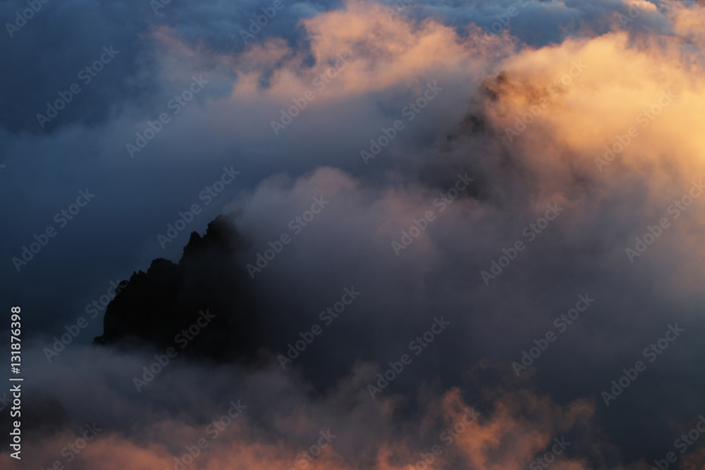 Sunrise over clouds in mountains