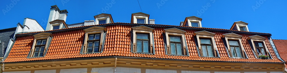 Panoramic view of red roof and dormers (Riga, Latvia) Panoramic view of red roof and dormers (Riga, Latvia)