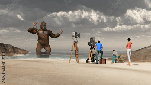 Huge gorilla, woman in his hand and film crew photo