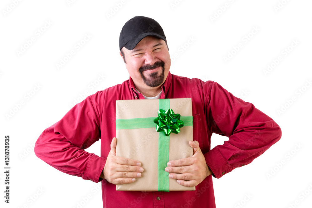 Excited man in baseball cap with wrapped present Excited man in baseball cap with wrapped present