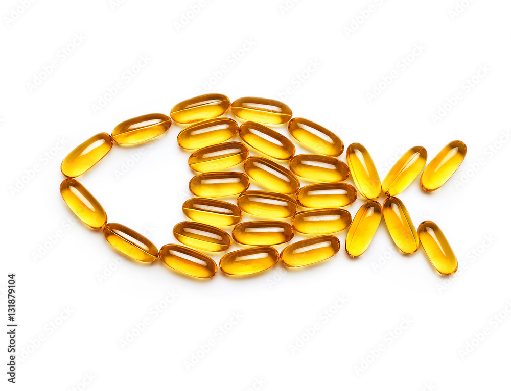 Fish from the Omega 3 capsules isolated on white background. Top view, copy space, high resolution product. Health care concept Fish from the Omega 3 capsules isolated on white background. Top view, copy space, high resolution product. Health care concept