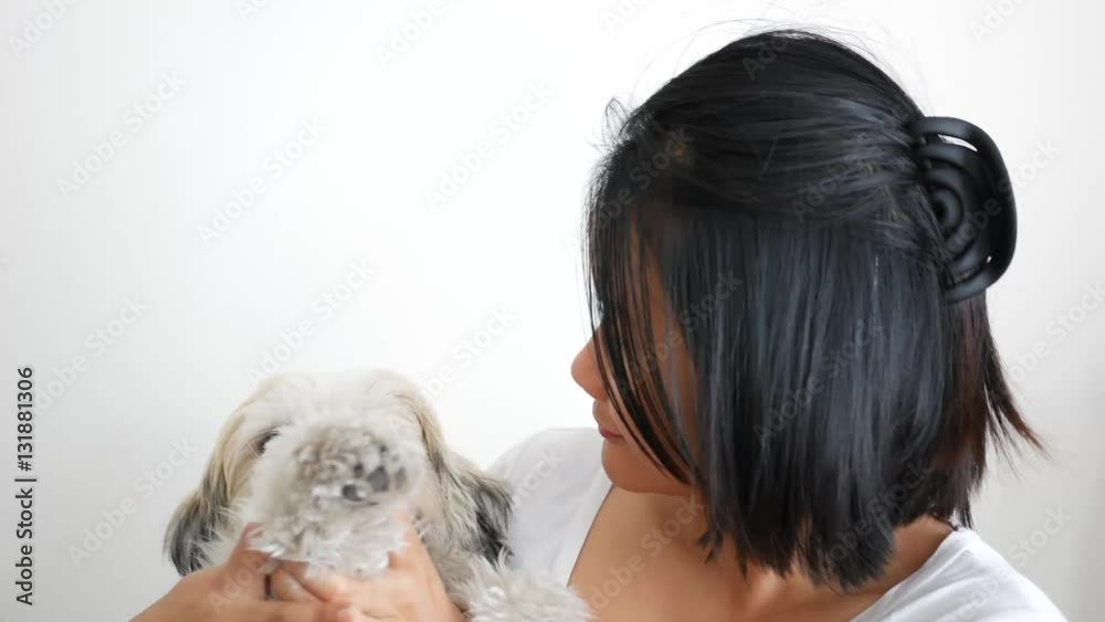 Asian woman playing with her dog Asian woman playing with her dog