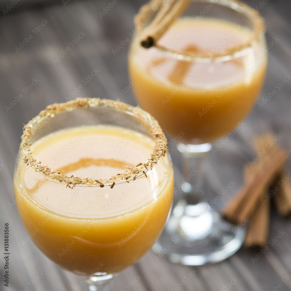 alcoholic beverage with orange juice and cinnamon alcoholic beverage with orange juice and cinnamon