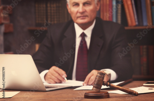Male judge working with documents in office