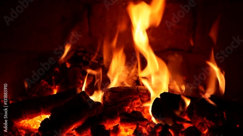 A fire burns in a fireplace