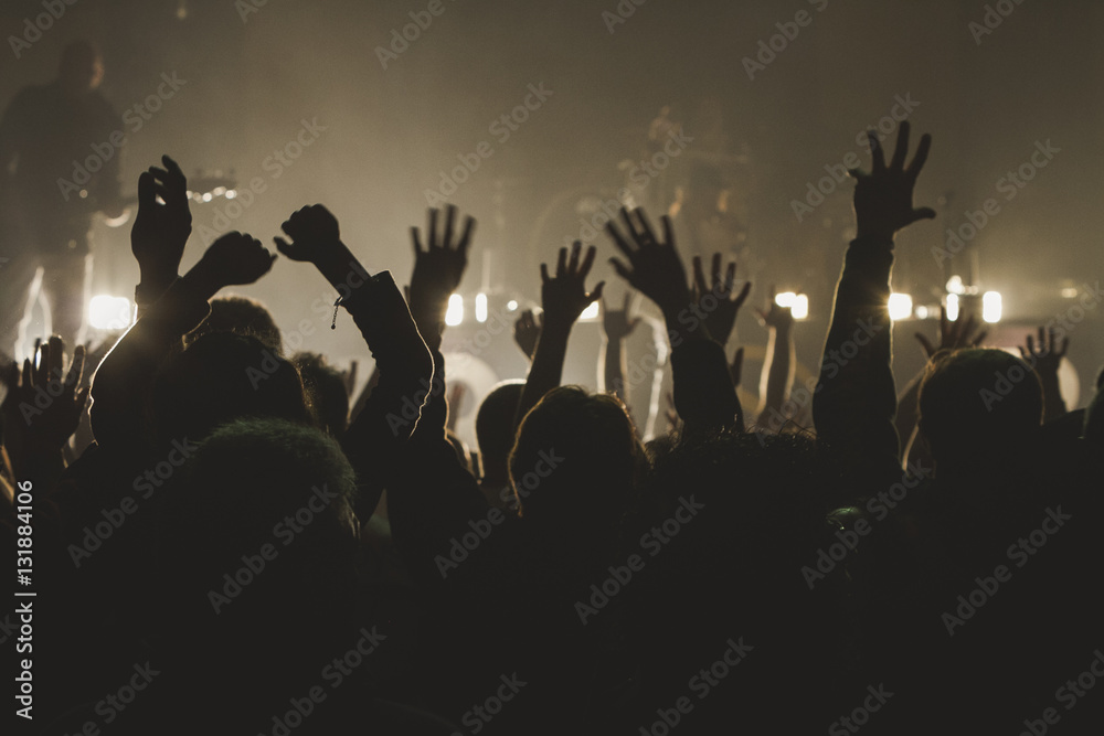 Silhouettes of concert crowd